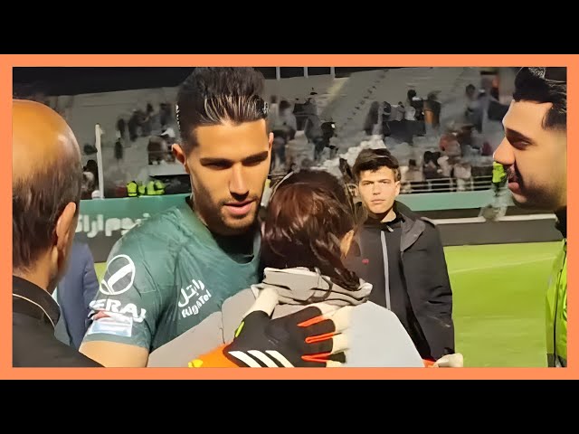 Iranian footballer banned for hugging female fan
